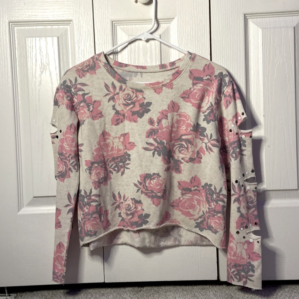 Girls Justice pink roses sweat shirt with cut outs in sleeves.